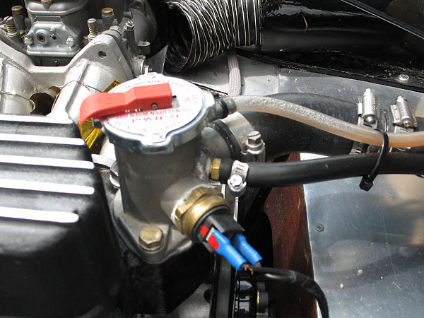 Thermostat housing with filler cap.