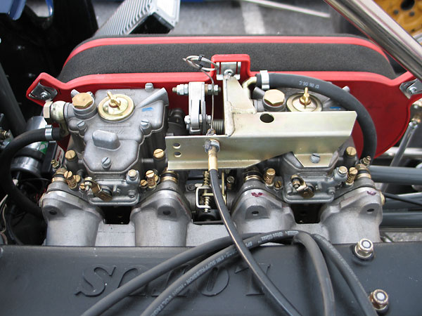 Dual Weber 45DCOE carburetors and Weber TLK1/W throttle linkage assembly.