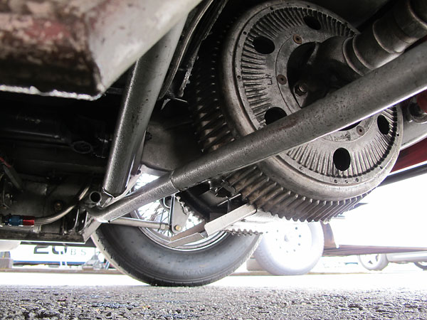 A Panhard rod connects the lefthand side of the rear suspension to the righthand side of the car's frame.