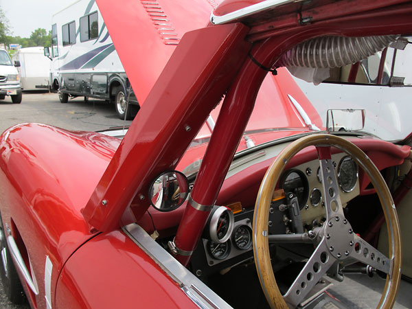 A-pillar air deflector: lower half directs airflow into the cockpit, top half provides air to the driver's helmet.