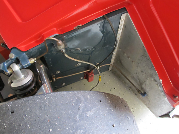 The Chevron B21 footbox and pedals are set behind the centerline of the front wheels.