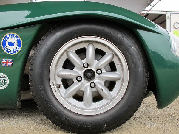 Panasport aluminum 8-spoke (6-JJx15) wheels.