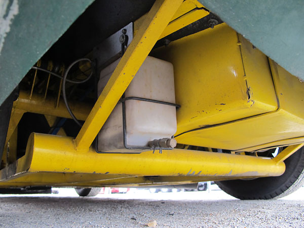 The overflow tank for the engine's cooling system, mounted next to a Fuel Safe eight gallon fuel cell.