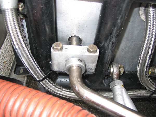 The front anti-roll bar is supported by these simple aluminum pillow blocks.