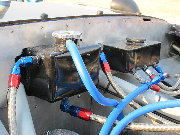 Custom fabricated aluminum coolant header tank (left) and brake fluid reservoir (right).