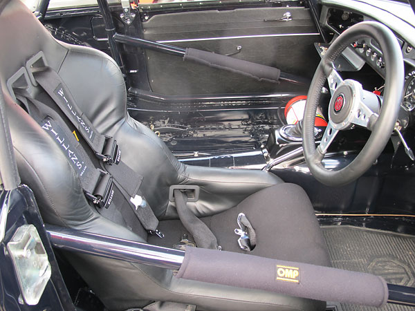 Robust rollcage with extra tubes across the door sills and behind the dashboard.