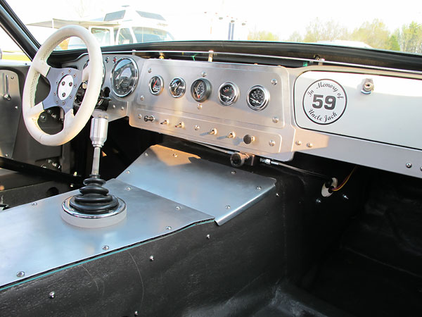A valve mounted at the lower edge of the dashboard is for adjustment of front-to-rear brake balance.