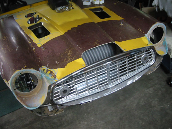Whoa! Just hours ago Dennis must have decided that the Triumph TR3A grille works better upside down.