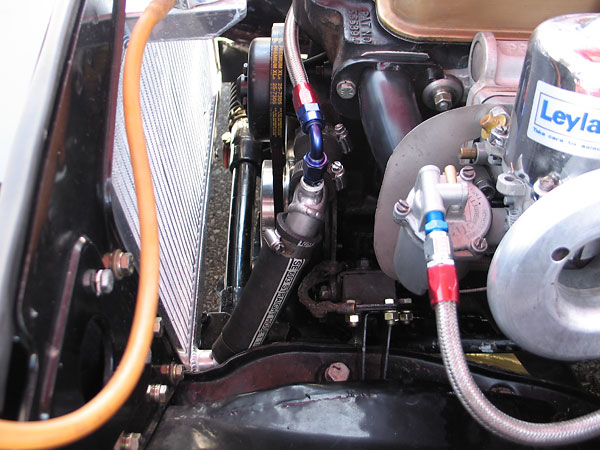 The radiator-mounted pressure cap is redundant with the pressure cap on the remote header tank.