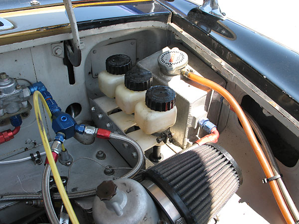 Tilton remote-mounted fluid reservoirs, and custom aluminum coolant header tank.