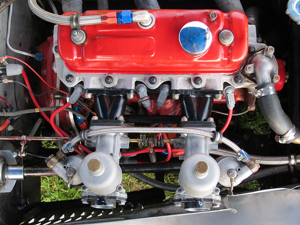 HRG crossflow aluminum cylinder head, HRG intake manifolds, and dual S.U. H6 (1 3/4 inch bore) carburetors.