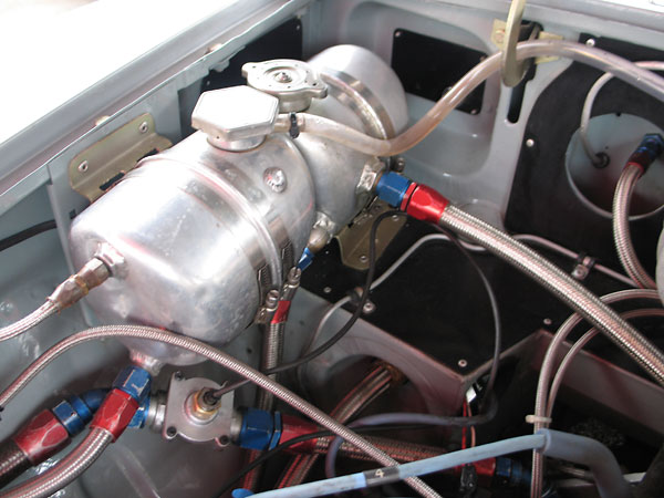 Coolant header tank (foreground) and oil system breather tank (background).
