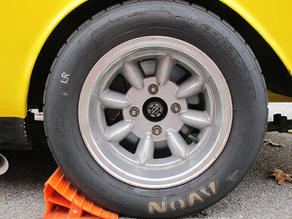 Performance (Superlite) 8-spoke 7x13 aluminum wheels with Avon AC B10 Sport 245/45/13 89V tires.