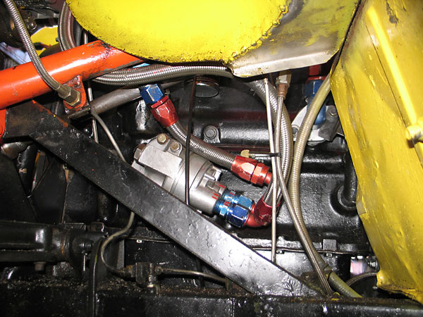 An adapter for a remote oil cooler mounted on the left-hand side of the engine.