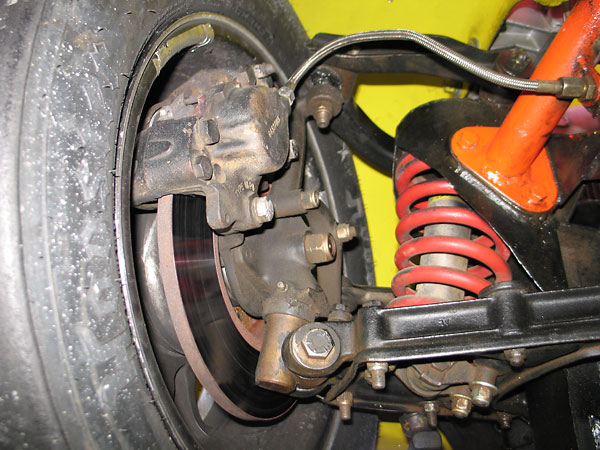 The front spring mounts have been braced rearward to the car's new roll structure.