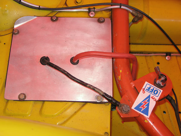 The battery has been relocated rearward, under the body and behind the seat, like on an MGB.