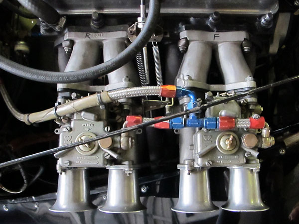 The restrictive Triumph TR2 log-type intake manifold is long gone, in favor of straight-thru manifolds.