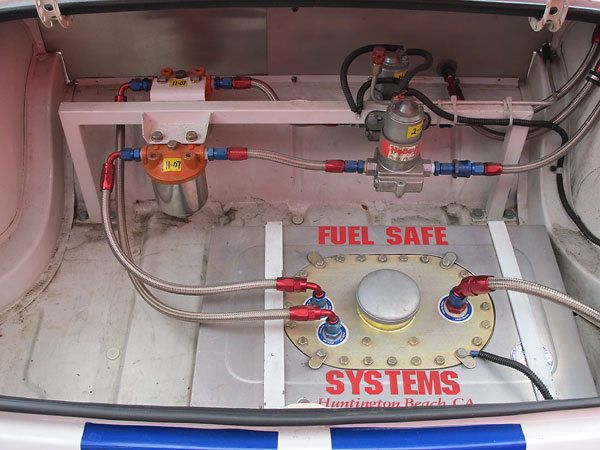 Fuel Safe Systems aluminum-can fuel cell, dual Holley red fuel pumps, and dual Fram HPG1 fuel filters.
