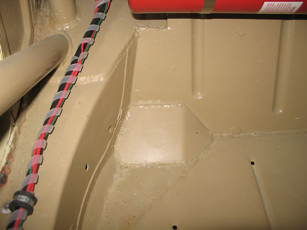 floor was also reinforced above the forward leaf spring mounts