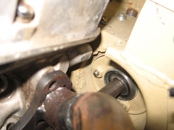 Steering shaft bearing-support firewall passthrough.