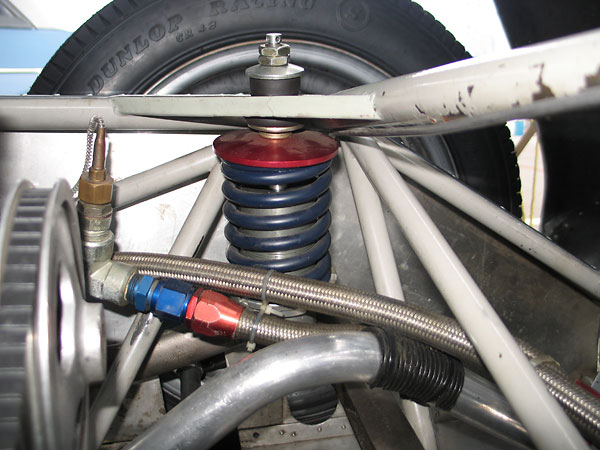 Original Girling coilover shock absorbers have been replaced by KONI units with adjustable valving.