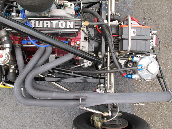 Ken Dye custom made this copy of the original four into one exhaust header.