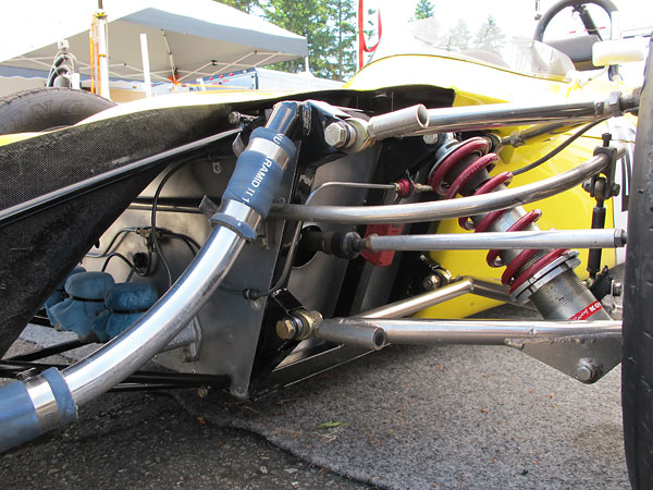 A portion of shock absorber mass moves up and down with the wheel.