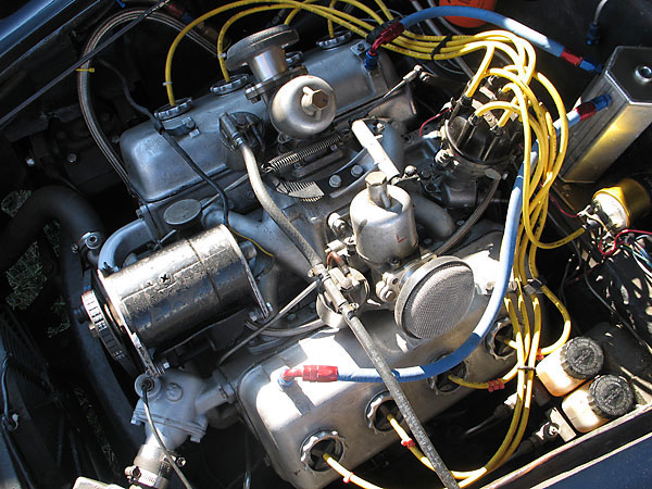 Notice the interesting coolant manifold and thermostat housing, underneath the Lucas generator.