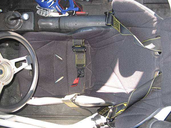 Kirkey aluminum racing seat, and Impact Racing five point latch-and-link safety harness.