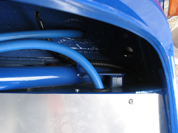 The fuel cell vent line runs up to the top of the roll cage, then back down through the floorboard.