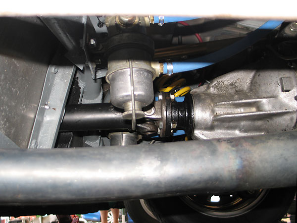 Dual fuel pumps on either side of the driveshaft and the rear suspension's third link.