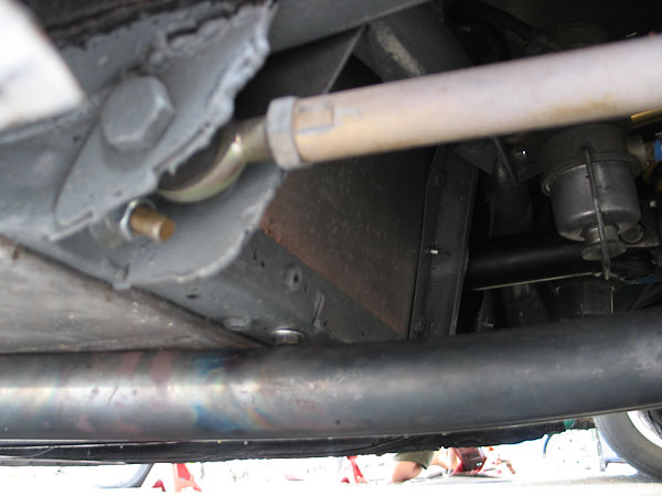 Lower front suspension mount on the body, plus radius rod and Heim joint.