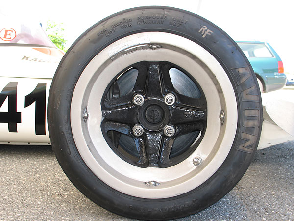 Lotus L122 magnesium alloy racing wheels (13x10 front, 13x14 rear).