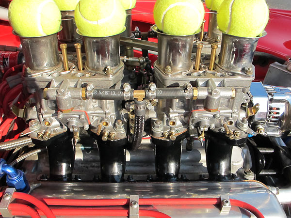 Four Weber 44IDF two-barrel carburetors mounted on custom fabricated intake manifolds.