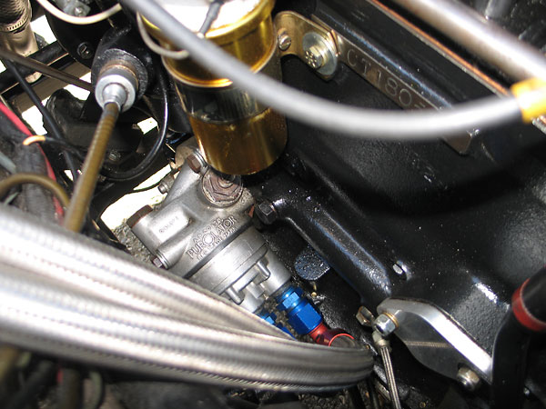 The tachometer drive cable comes off the Lucas distributor.
