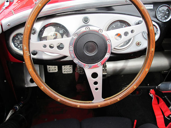 Tourist Trophy 15 inch laminated wood rim steering wheel with drilled holes and satin finish.