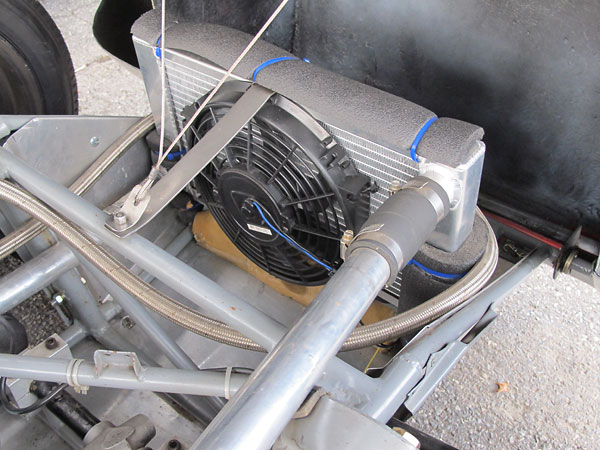 Custom aluminum crossflow radiator and electric cooling fan.
