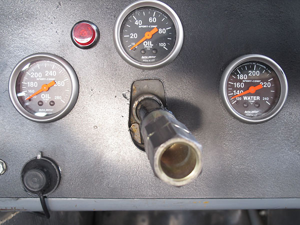 Auto Meter SportComp oil temperature, oil pressure, and water temperature gauges.