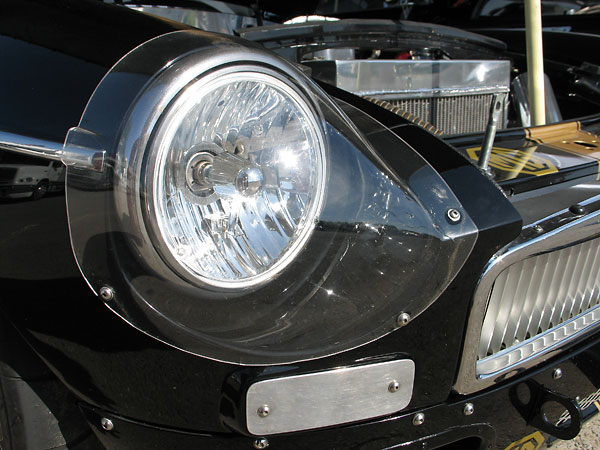 Euro 7 inch round halogen headlight. Sebring style headlamp cover.