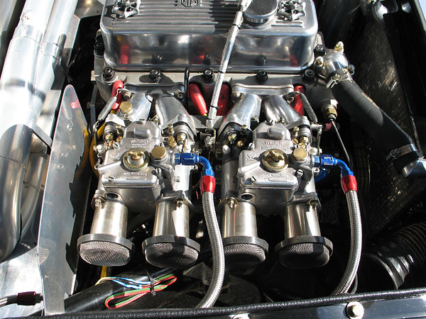 Dual Weber 45DCOE carburetors with flange-style velocity stacks and mesh filters.