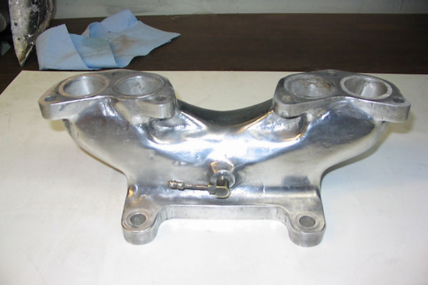 John Camden designed this intake manifold and had it sand-cast for the Super-B.