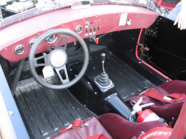 Custom fabricated aluminum bucket seats (one original and one new).