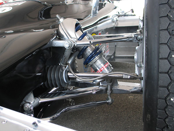 The pivoting cast-aluminum shock absorber mounting was clearly derived from a Lotus 70.