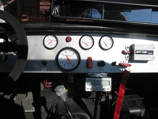 Stewart Warner Maximum oil pressure, tachometer, oil temperature, and water temperature gauges.