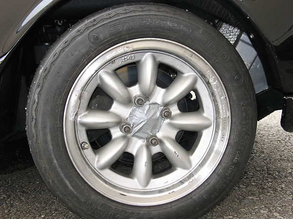 Panasport Racing 13x6 aluminum wheels.