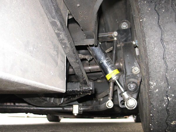 Z-bar reduces the swing axle's inherent tendency towards jacking.