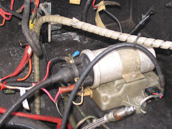The ignition coil is sitting on top of a Lucas electronic ignition amplifier.