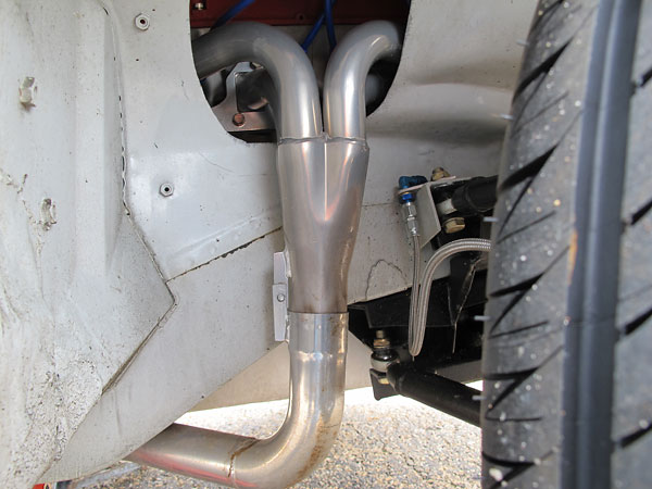 RV8-style (through the fender) four into one headers, ceramic coated.