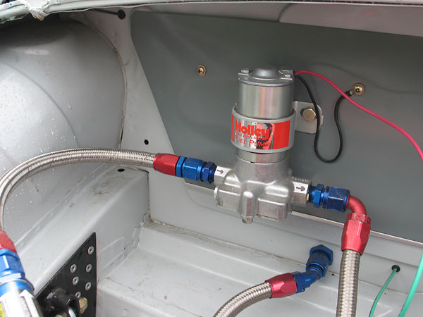 Holley red electric fuel pump.