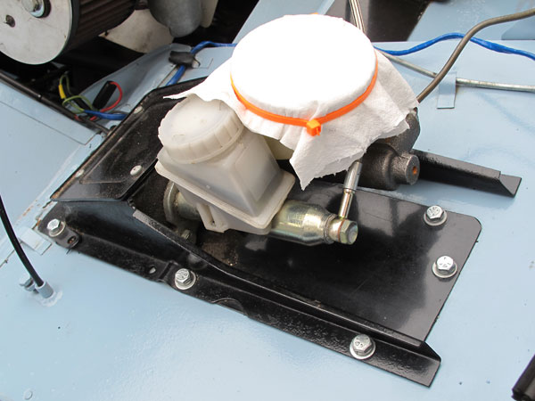 Later model Spridget master cylinder has separate front and rear circuits for safety.